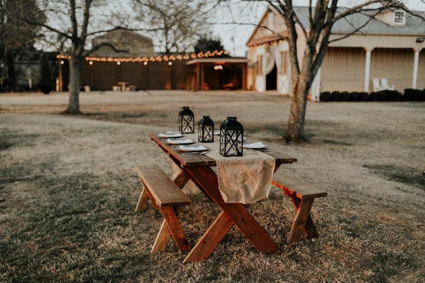 Image of simply dress dining table that is outdoors.